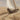 Close-up of a man in a boat with a sail, sailing through a field of grain. Sail of Straw