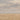 Close-up of a cloudy sky over a rolling field of grain on the horizon. Sail of Straw