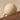Close-up of a man pushing a large white sphere up a steeply sloping mountainside. Ochre Ascent