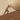 Close-up of the man's body pressing against the sphere, muscles straining against the slope. Ochre Ascent