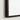 Corner of a walnut frame with white canvas